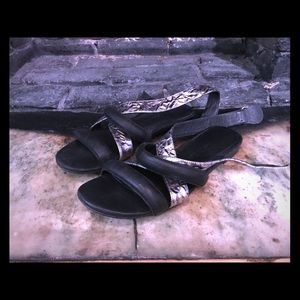 Women’s intentionally blank black / silver sandals